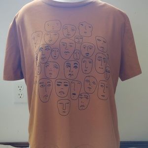Dark orange crop top with lineart faces size XL